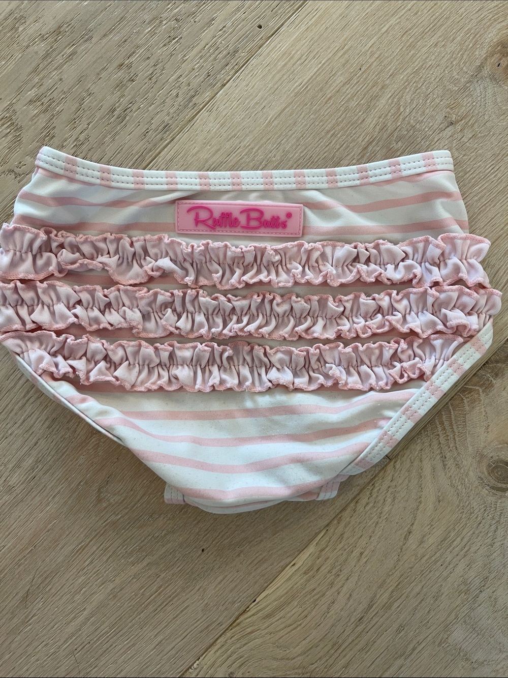 Ruffle Butts Pink and White Striped Ruffle swim bottom size 18-24 months